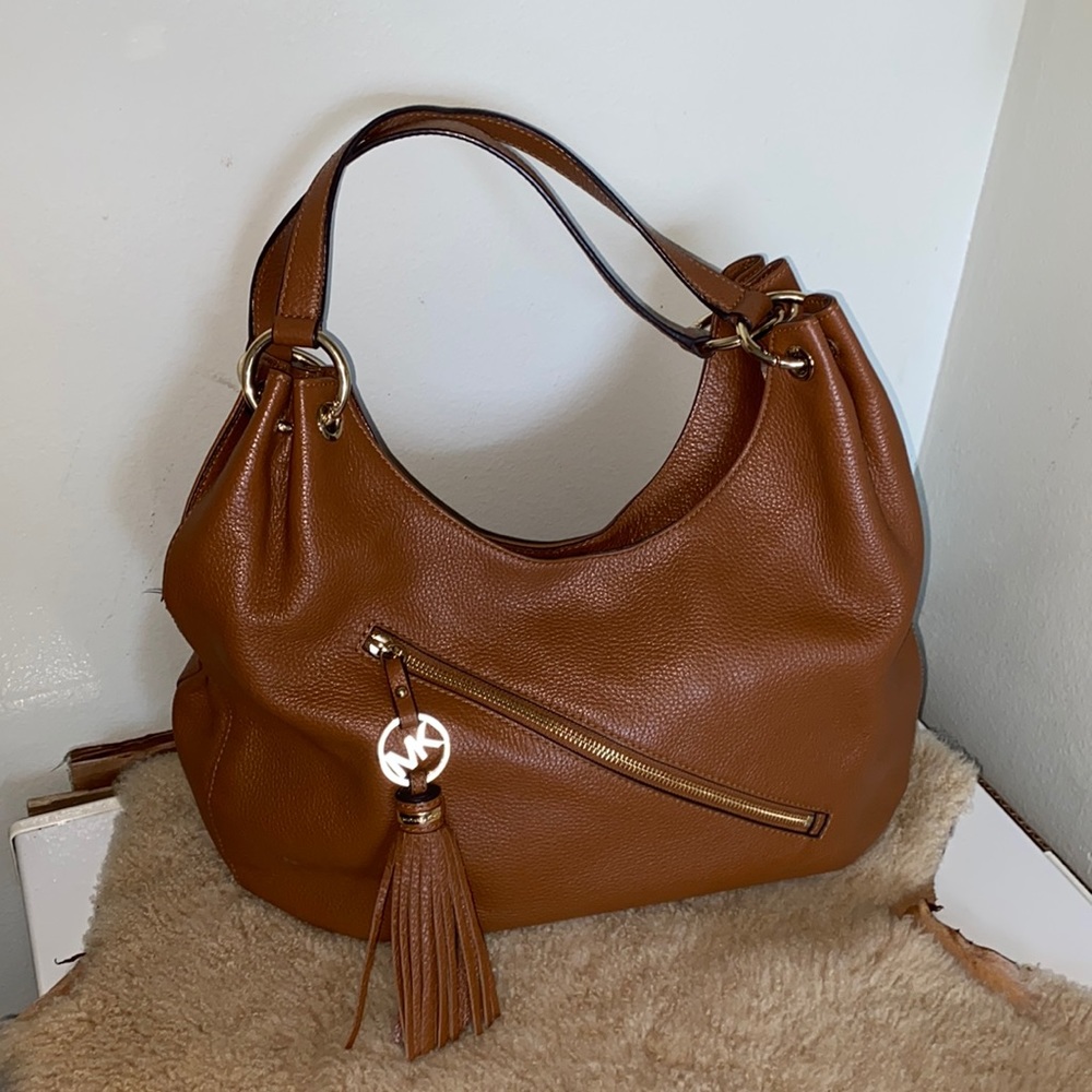 Michael Kors Brown bag with a front zipper with tassel